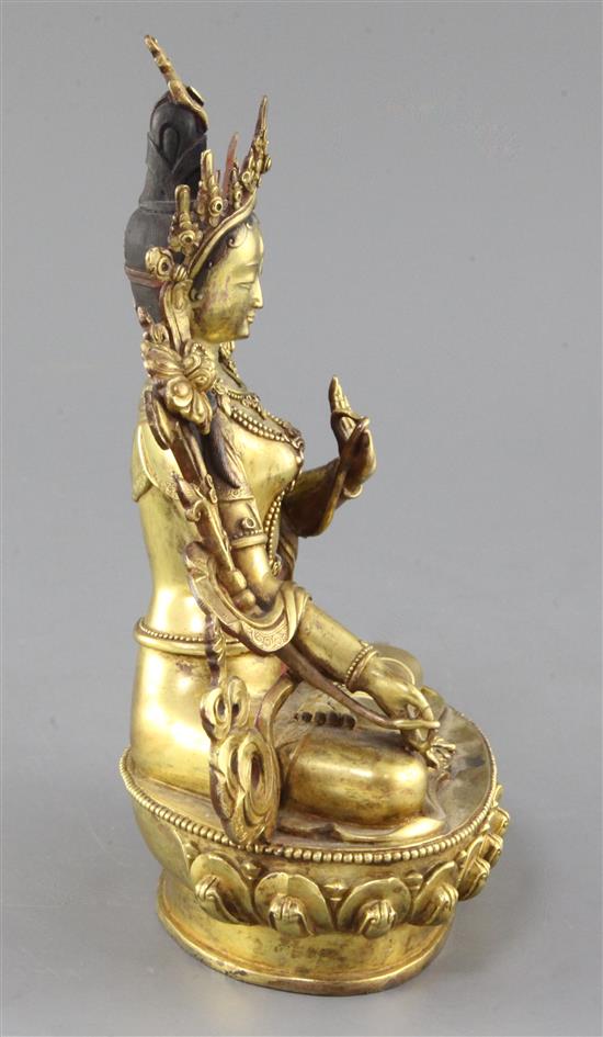 A Tibetan gilt bronze seated figure of White Tara, height 22cm